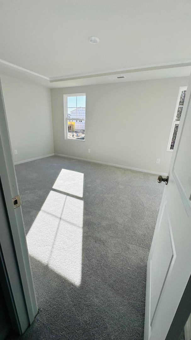 114 Red Brush Way Apex, NC 27539 - Photo 10 of 22 a view of an empty room and window
