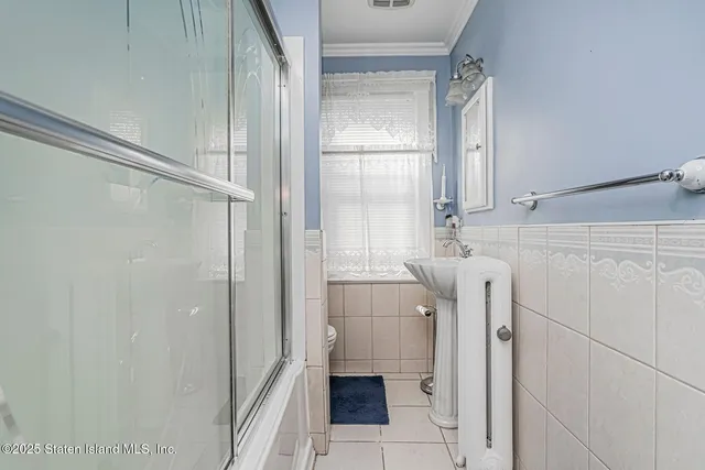 a bathroom with a sink a mirror and a shower