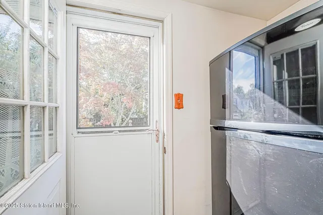 a view of a door and a window