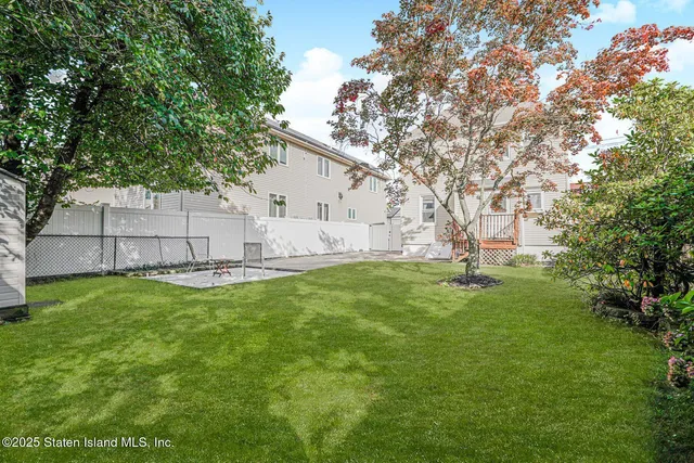 a view of backyard with green space