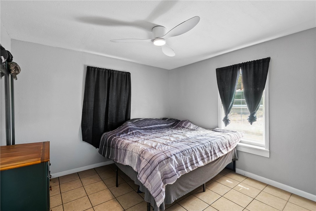 519 Claride Street Corpus Christi, TX 78418 - Photo 12 of 15 a bedroom with a bed and a window