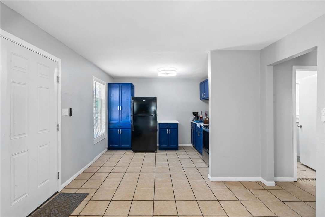 519 Claride Street Corpus Christi, TX 78418 - Photo 8 of 15 a view of a refrigerator in kitchen and an empty room