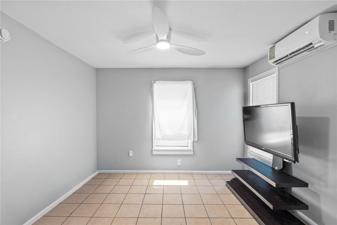 519 Claride Street Corpus Christi, TX 78418 - Photo 10 of 15 a living room with projector and screen