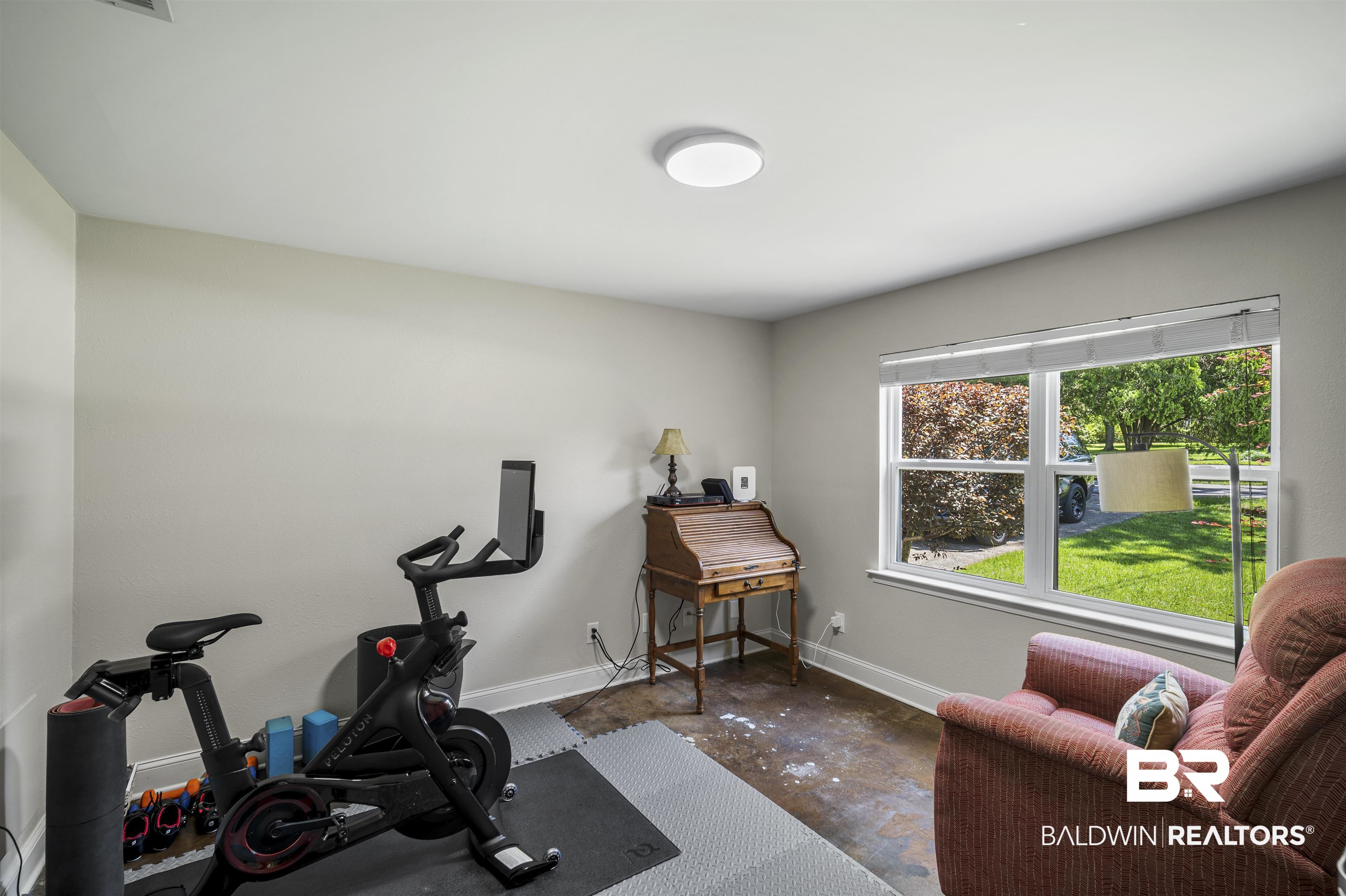 1615 5th Street Daphne, AL 36526 - Photo 22 of 28 Versatile room featuring a large window, neutral wall paint, and overhead lighting