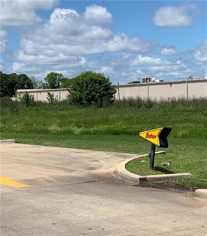 0 Mansfield Road Shreveport, LA 71108 - Photo 6 of 10 a view of a park with a bench and trees in the background