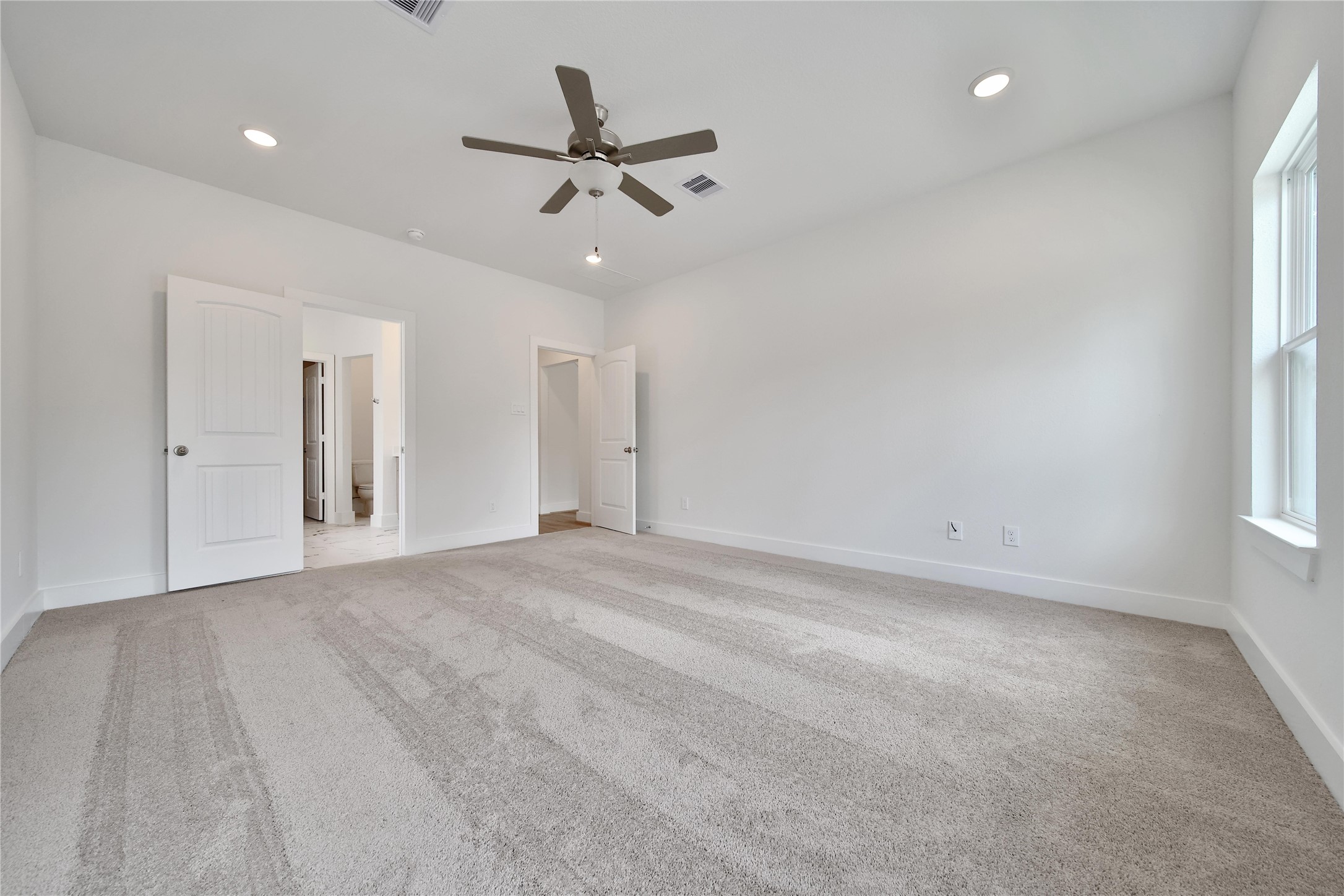 1003 Thor New Caney, TX 77357 - Photo 12 of 45 a view of a livingroom with a ceiling fan and window
