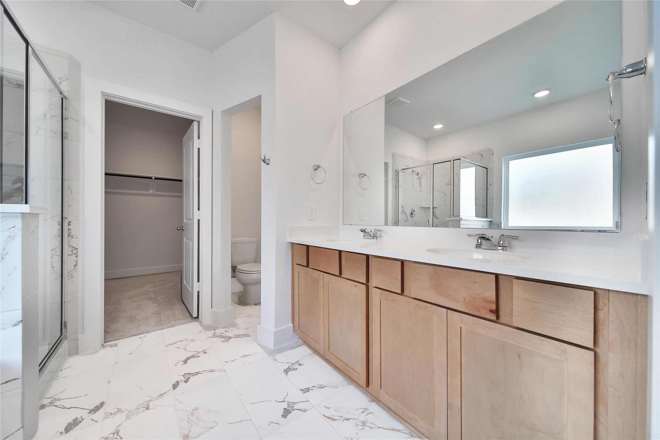 1003 Thor New Caney, TX 77357 - Photo 15 of 45 a bathroom with a double vanity sink mirror and shower