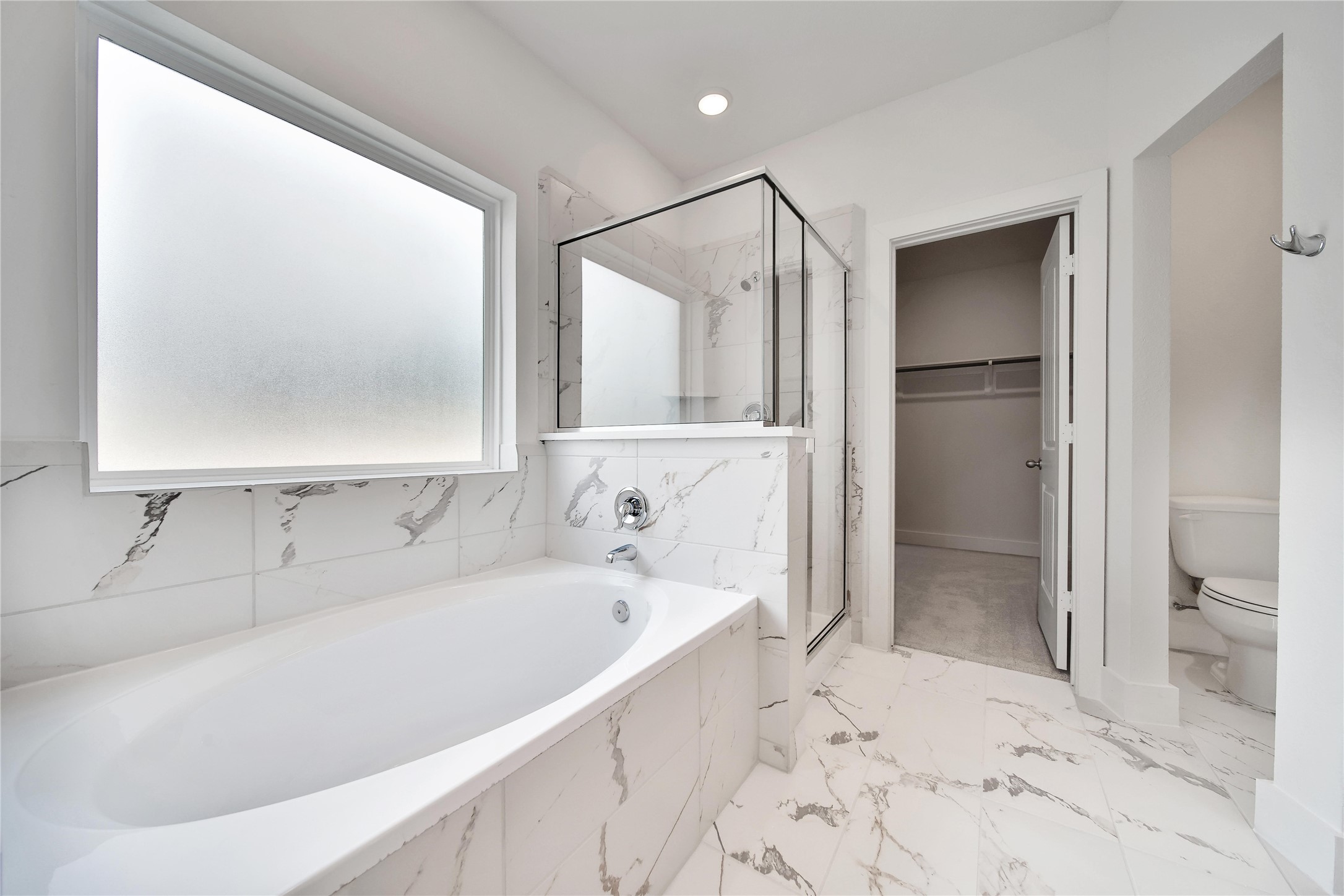 1003 Thor New Caney, TX 77357 - Photo 18 of 45 a bathroom with a bathtub and a shower