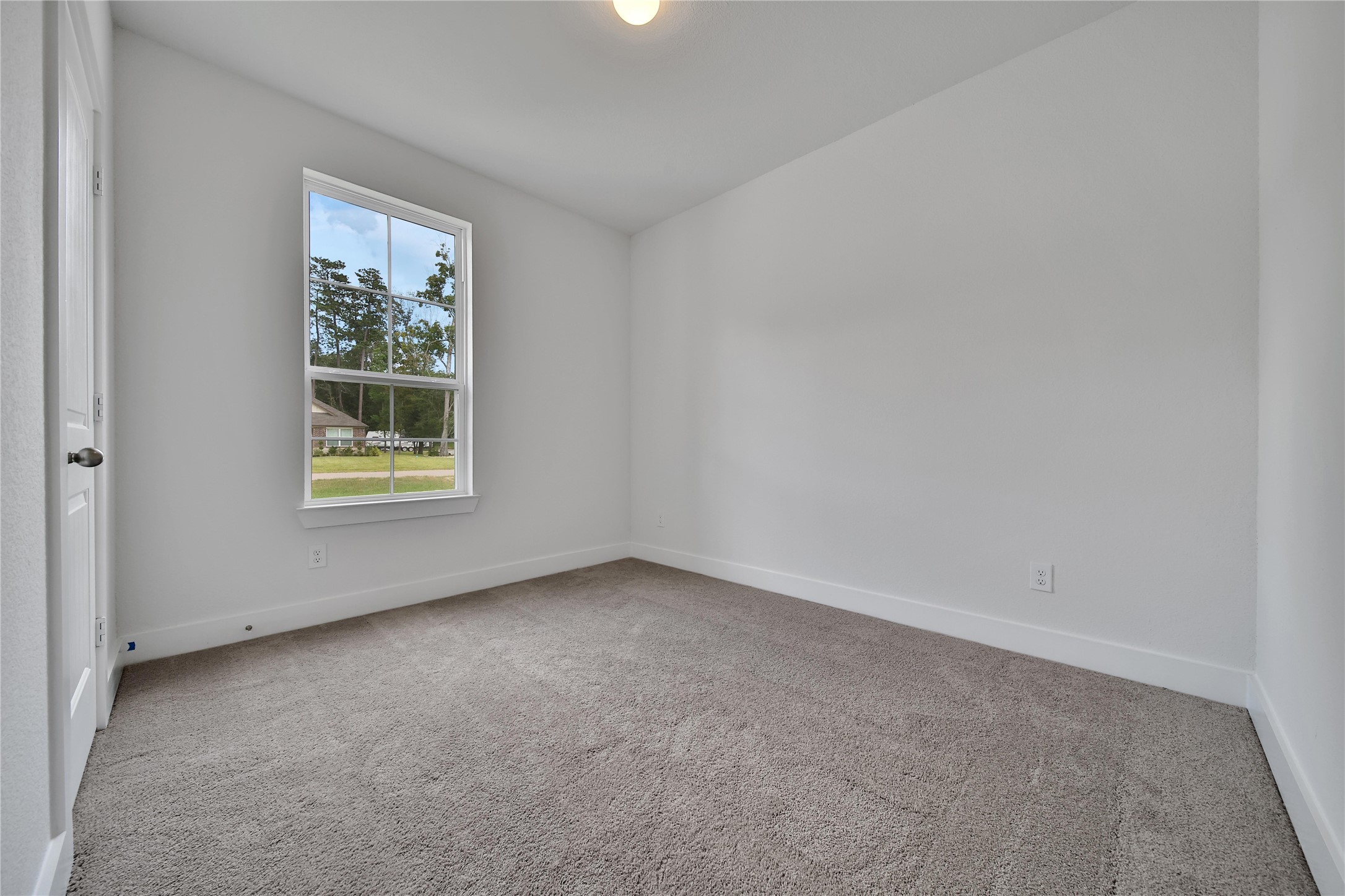 1003 Thor New Caney, TX 77357 - Photo 25 of 45 an empty room with windows