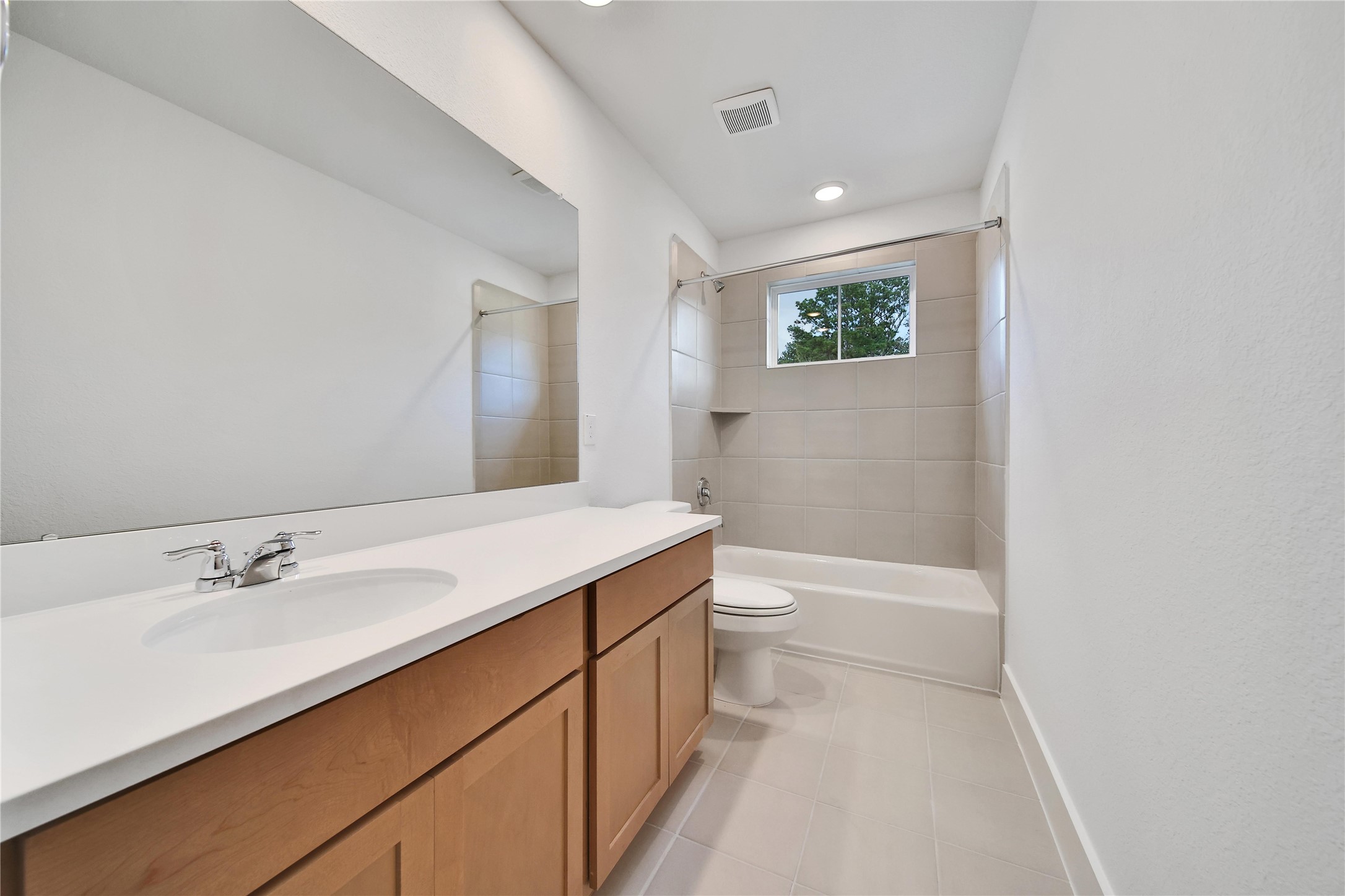1003 Thor New Caney, TX 77357 - Photo 27 of 45 a bathroom with a sink a toilet and shower