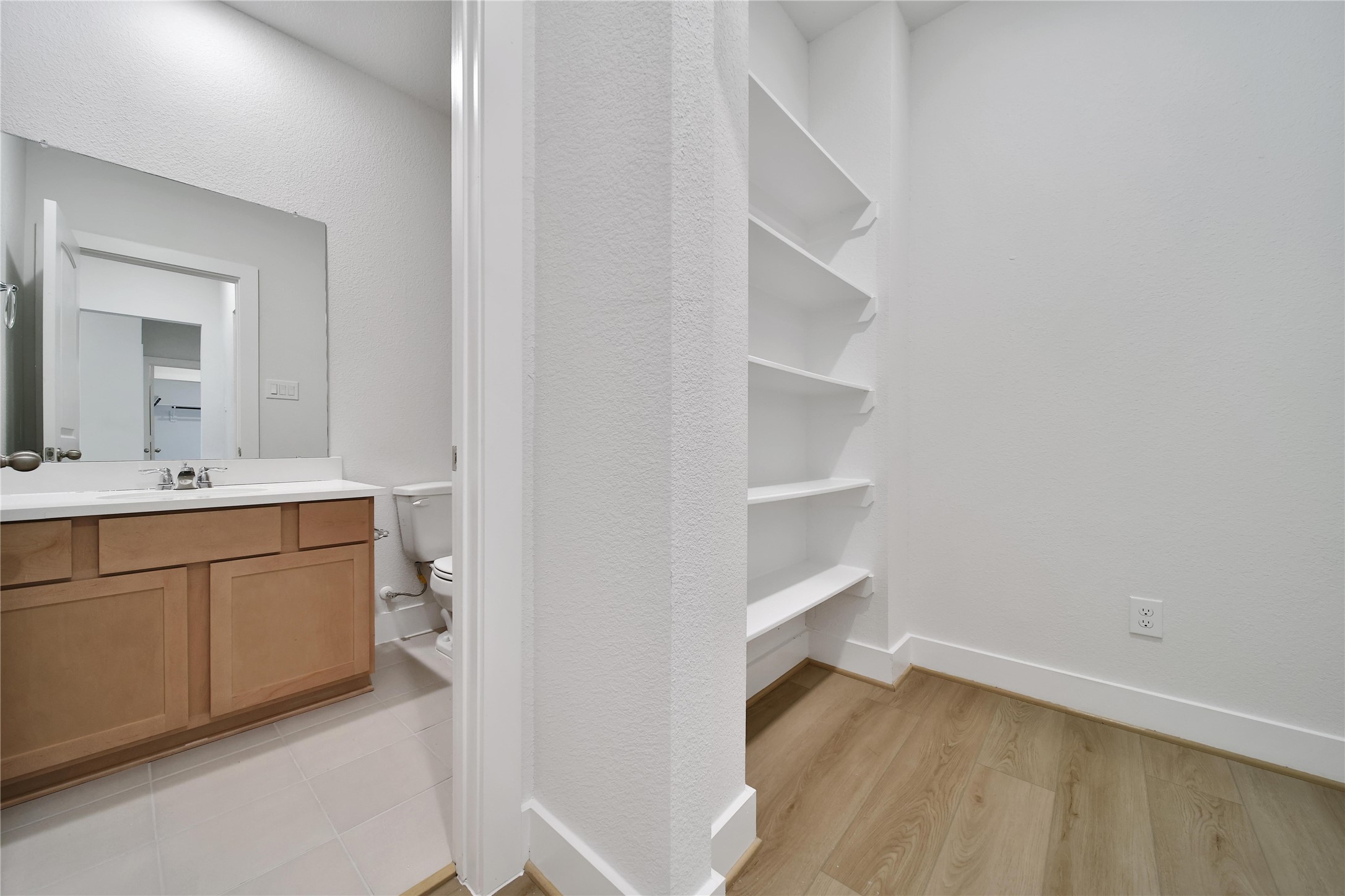 1003 Thor New Caney, TX 77357 - Photo 28 of 45 a bathroom with a sink and a mirror
