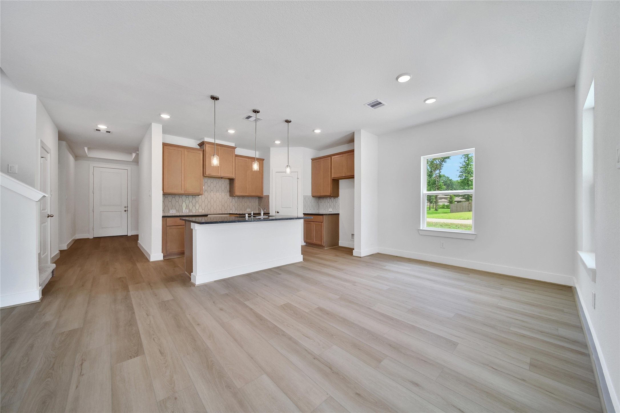 1003 Thor New Caney, TX 77357 - Photo 3 of 45 a view of kitchen with wooden floor and window