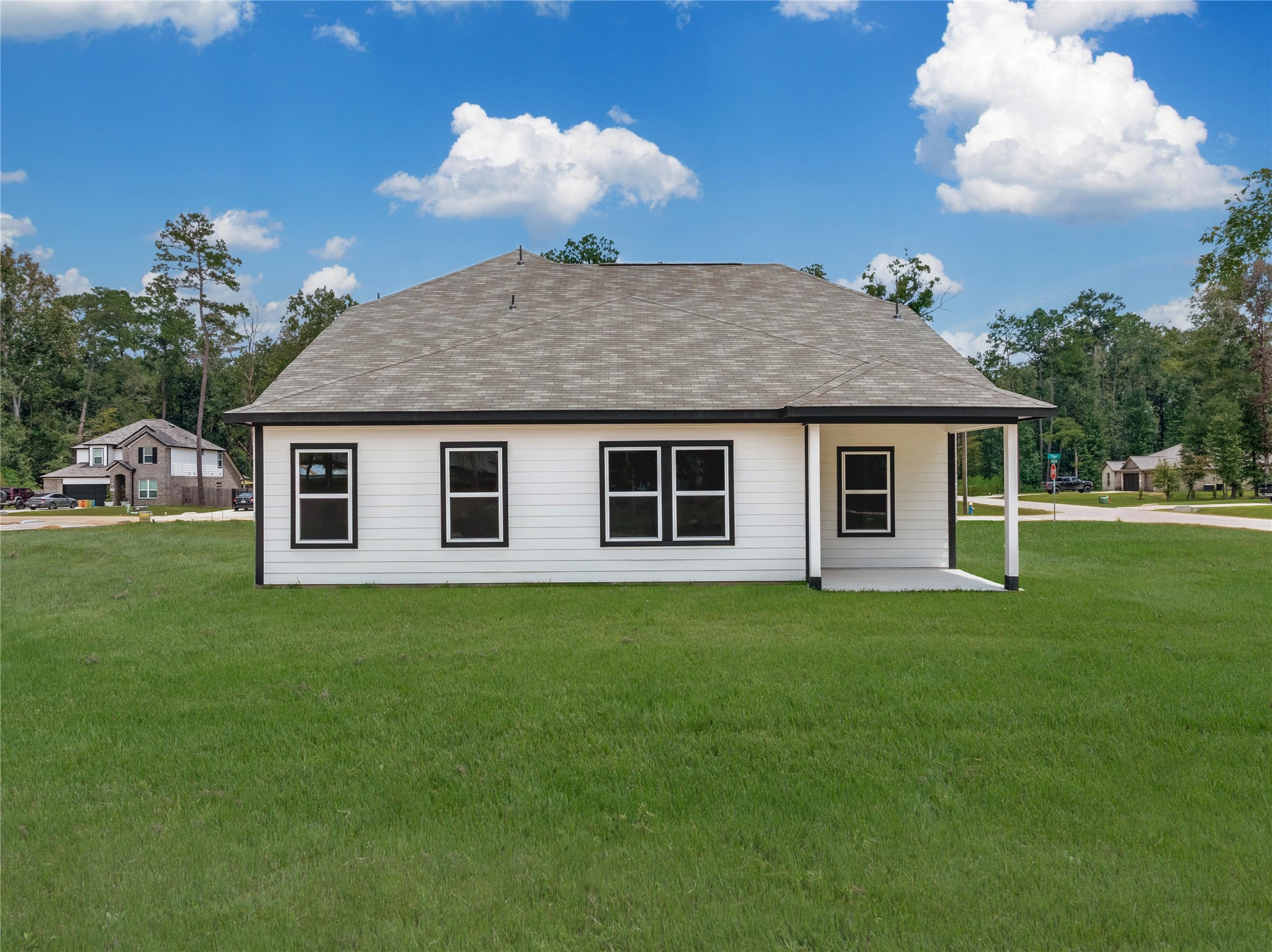 1003 Thor New Caney, TX 77357 - Photo 31 of 45 a front view of a house with a garden