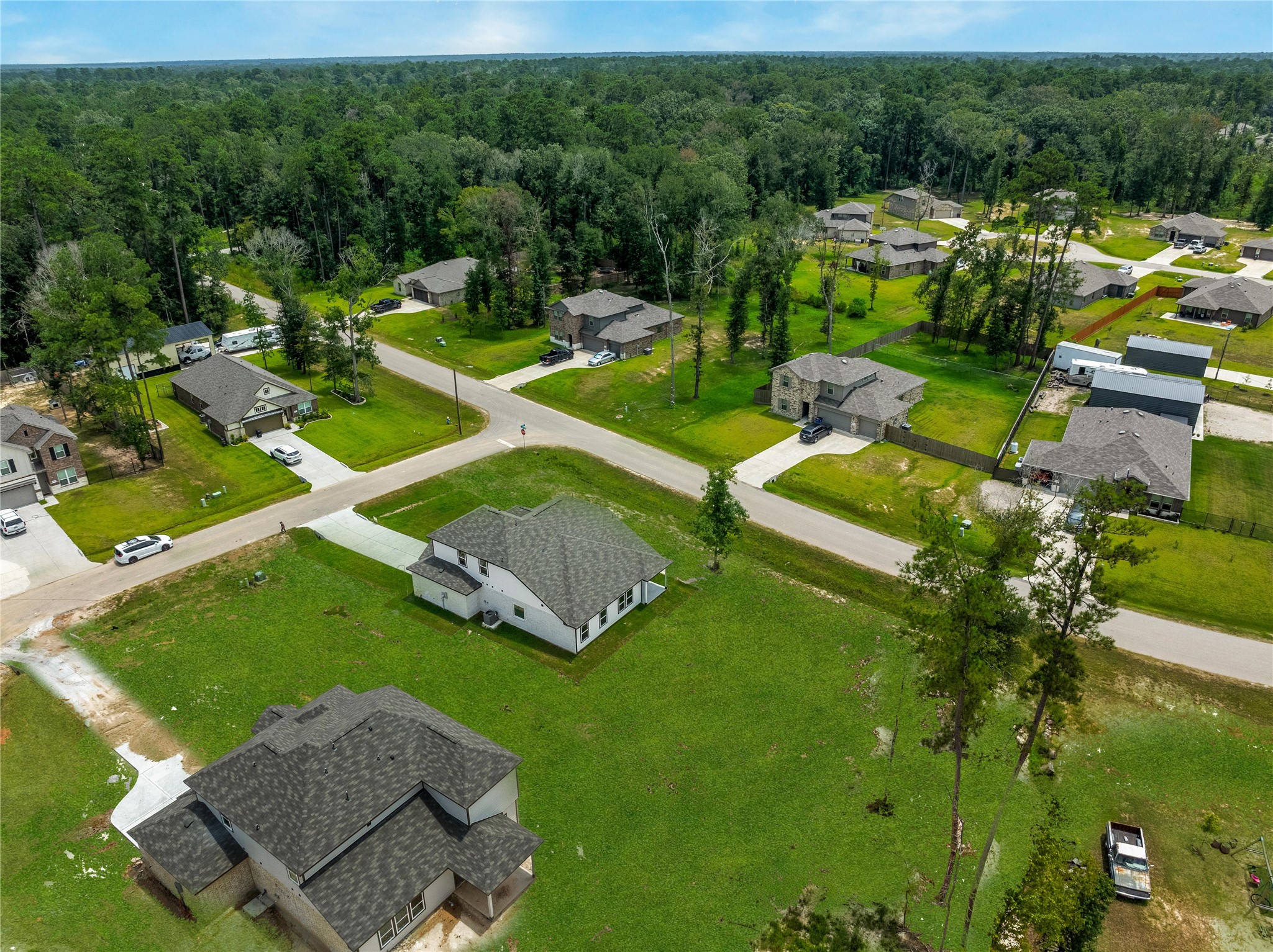 1003 Thor New Caney, TX 77357 - Photo 33 of 45 an aerial view of a house with a garden and swimming pool