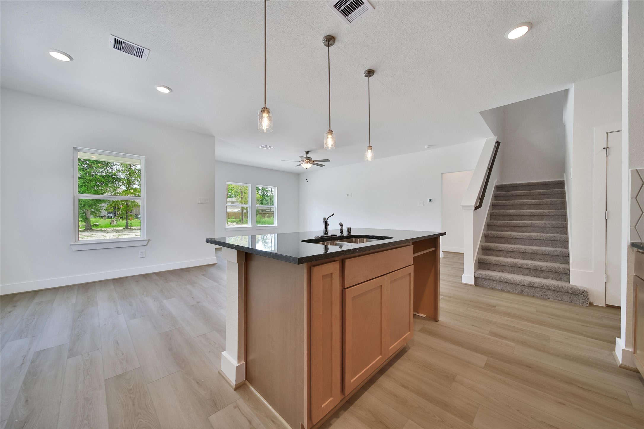 1003 Thor New Caney, TX 77357 - Photo 8 of 45 a kitchen with stainless steel appliances granite countertop a sink a stove a refrigerator and wooden floor