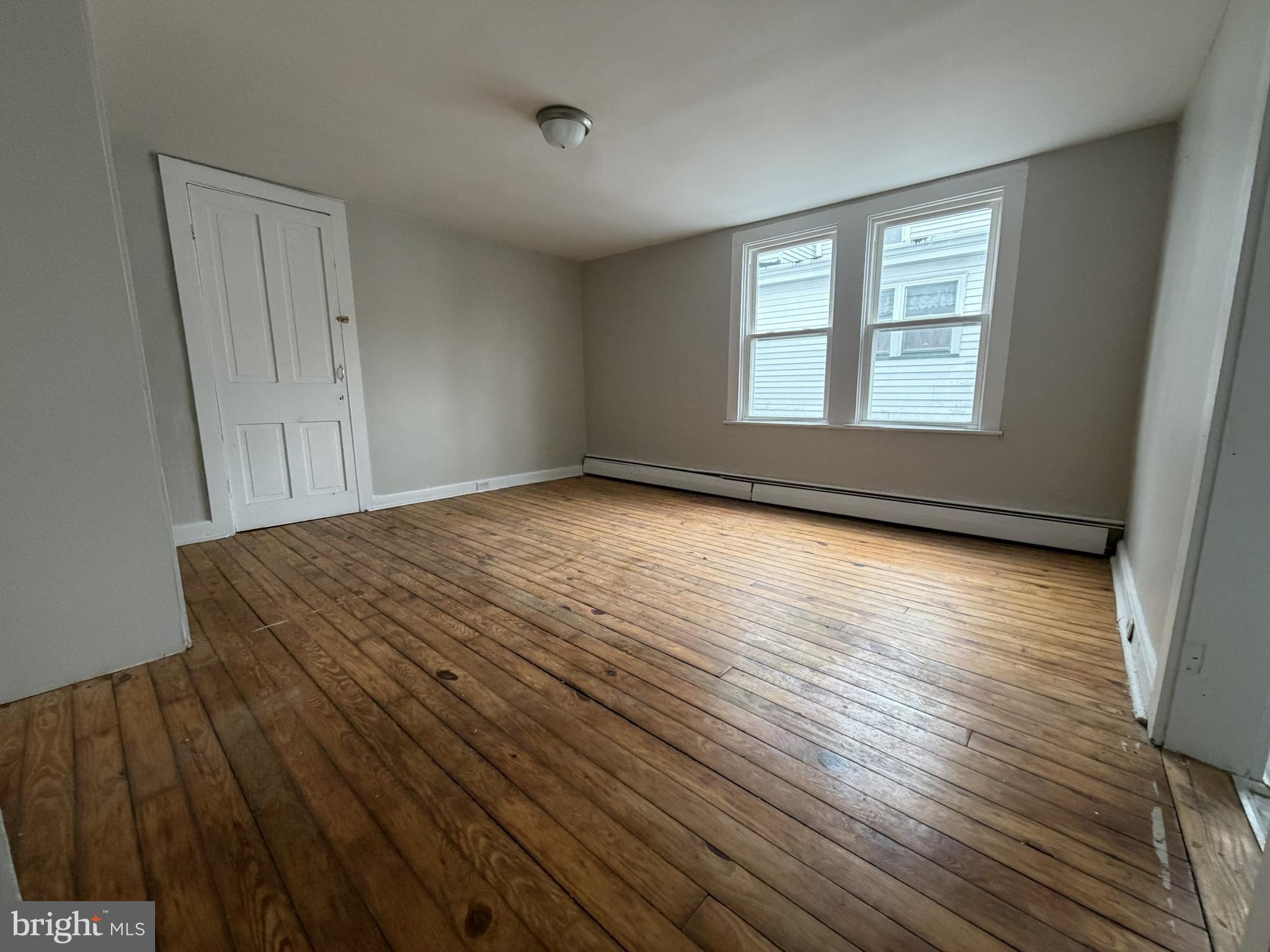 190 7th Street, Unit 1 Salem, NJ 08079 - Photo 7 of 16 a view of a room with wooden floor and window