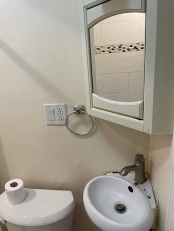 272-2 Nevada Street, Unit 2 Newton, MA 02460 - Photo 25 of 28 a bathroom with a sink and a mirror
