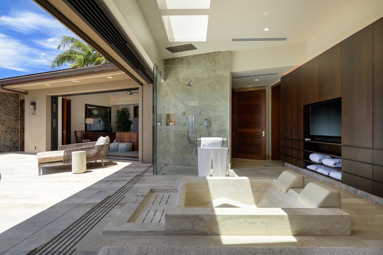 4809 Lower Honoapiilani Road Lahaina, HI 96761 - Photo 24 of 49 a lobby with furniture and a flat screen tv