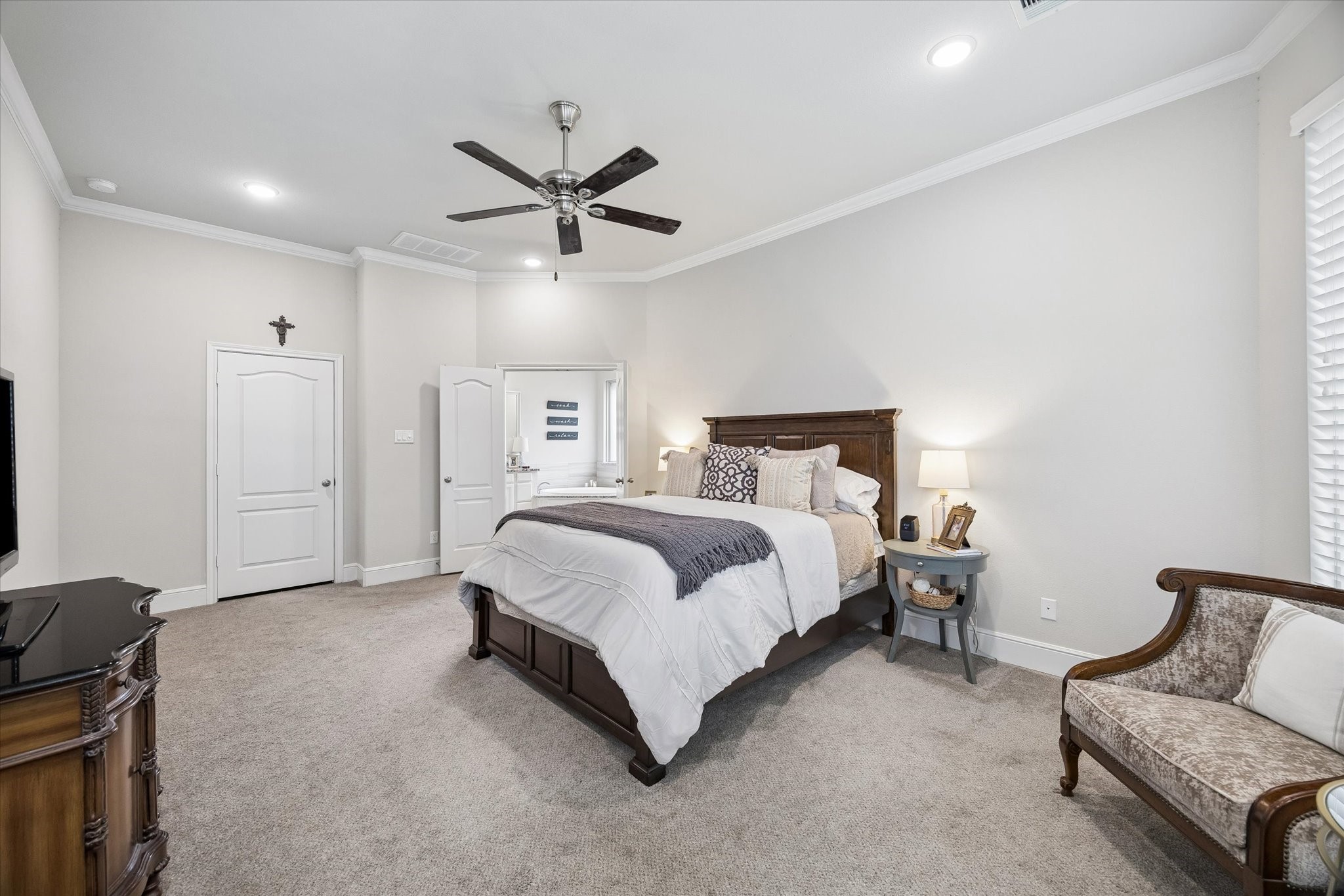 19 Peace Tree Way Tomball, TX 77375 - Photo 25 of 36 Spacious primary suite featuring a clear view into the en suite bathroom.
