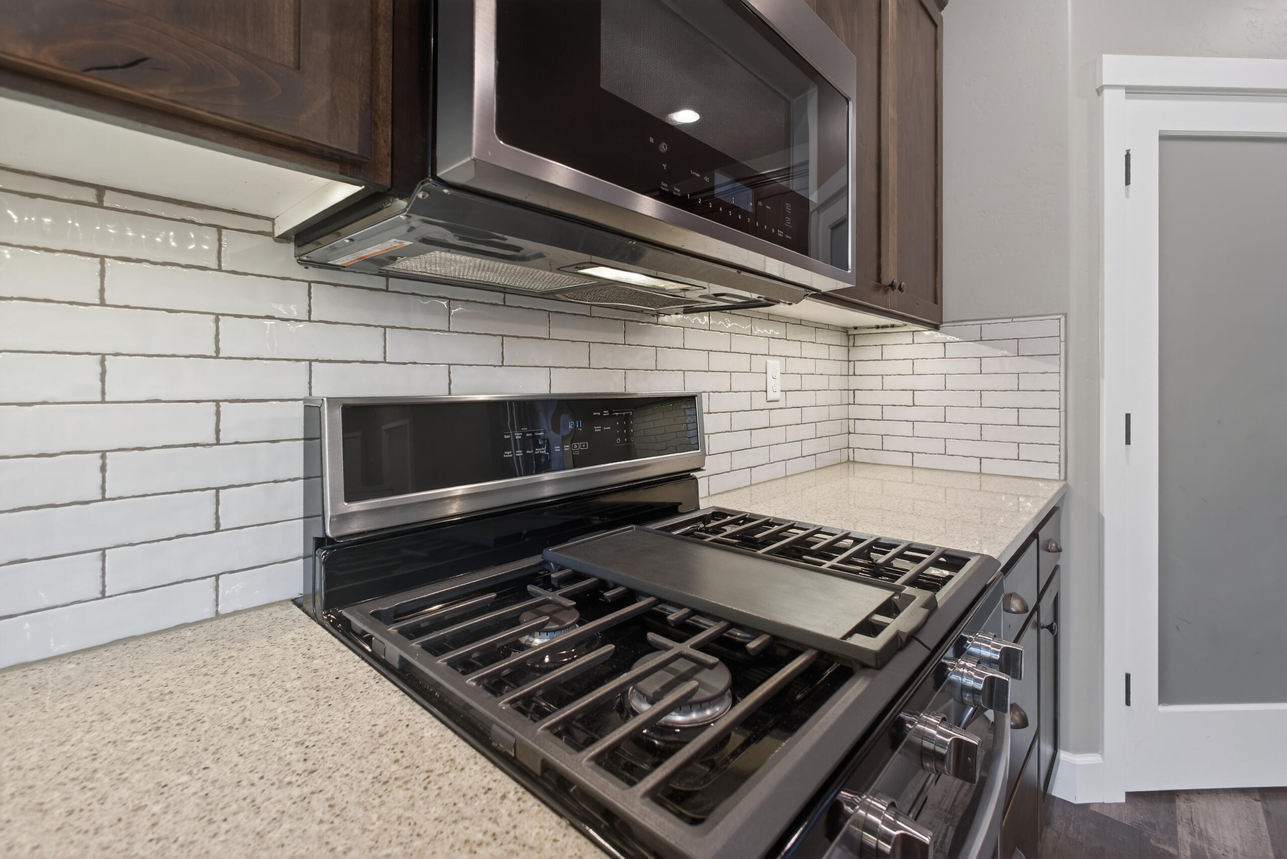 2793 Southwest 33rd Street Redmond, OR 97756 - Photo 14 of 44 a stove top oven sitting inside of a kitchen