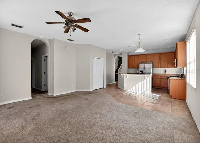 a view of a kitchen with a sink and a window