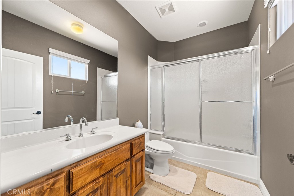 38136 Butterfly Court Yucaipa, CA 92399 - Photo 55 of 71 a bathroom with a sink a toilet and shower