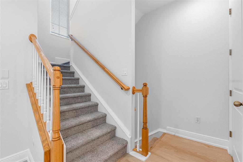 5902 Printery Street, Unit 105 Tampa, FL 33616 - Photo 22 of 54 a view of entryway and hall with wooden floor