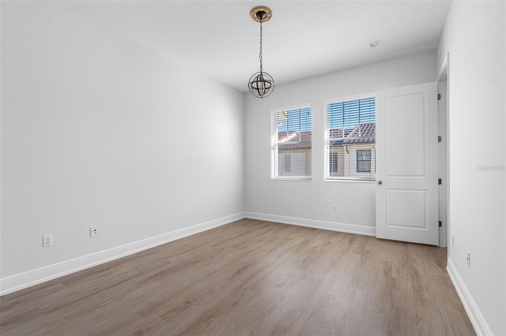 5902 Printery Street, Unit 105 Tampa, FL 33616 - Photo 32 of 54 wooden floor in an empty room with a window
