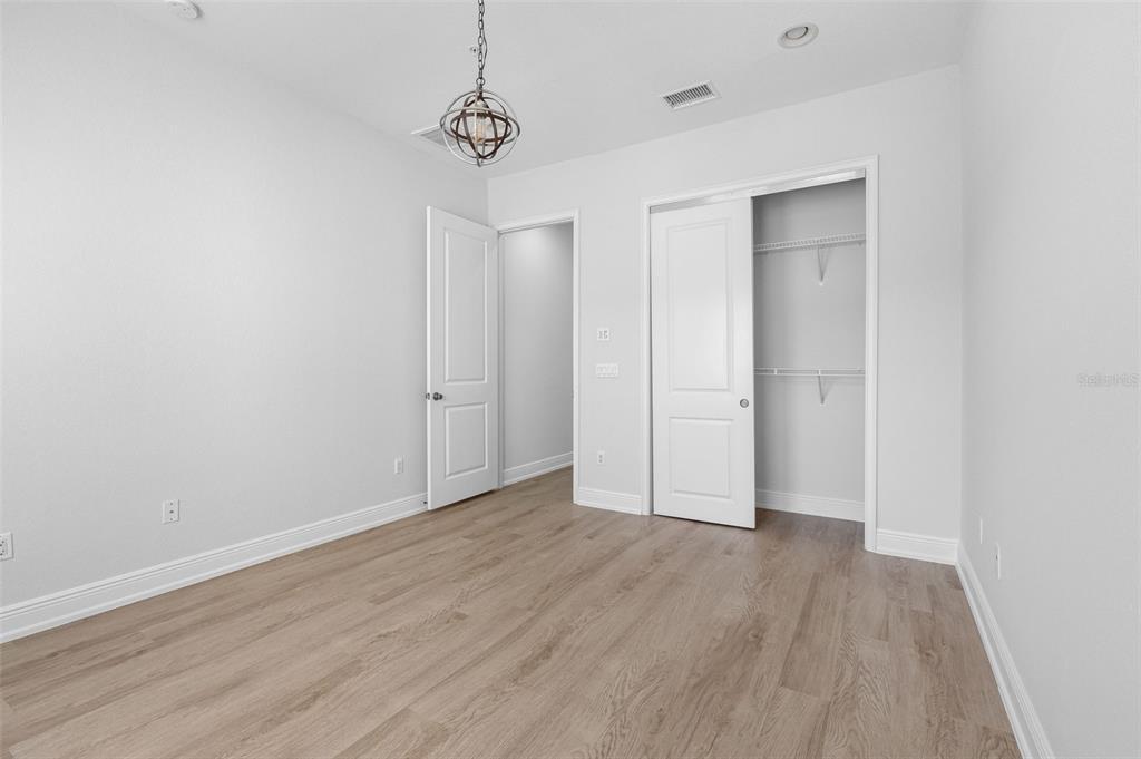 5902 Printery Street, Unit 105 Tampa, FL 33616 - Photo 33 of 54 a view of an empty room with wooden floor