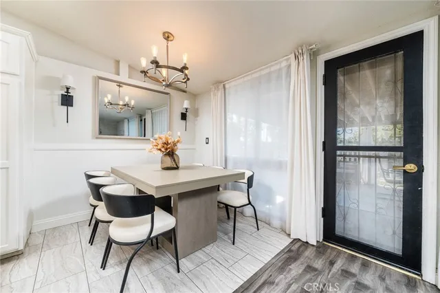 a large kitchen with a sink and refrigerator