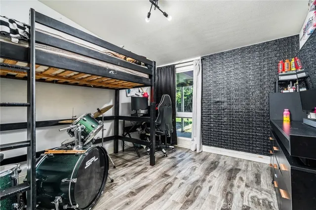 a bedroom with a bed and a dresser