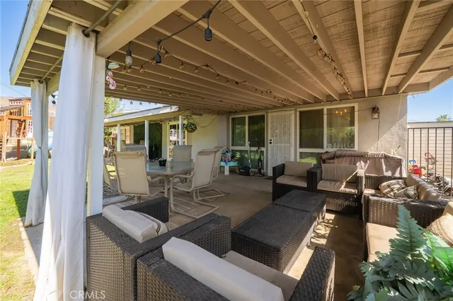 a view of a dining room with furniture window and outside view