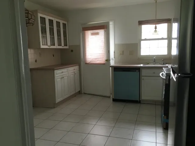 a view of cabinets and window