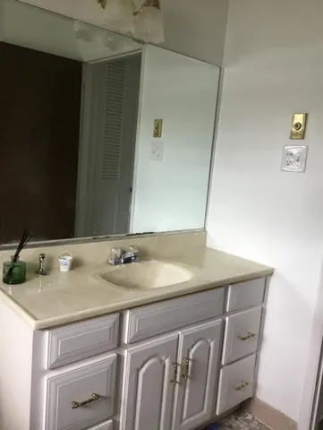 a front view of a house with a garden and porch