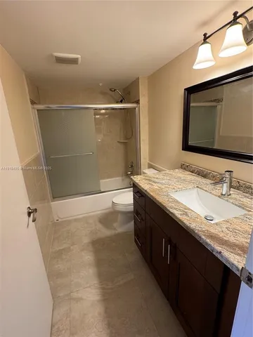 a view of empty room with windows