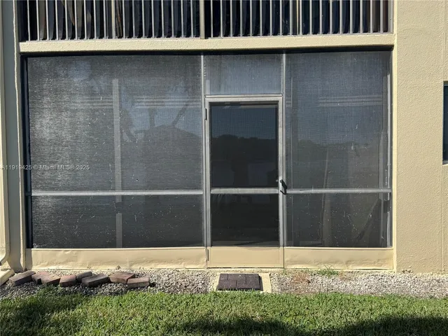 a view of a lake with a house in the background