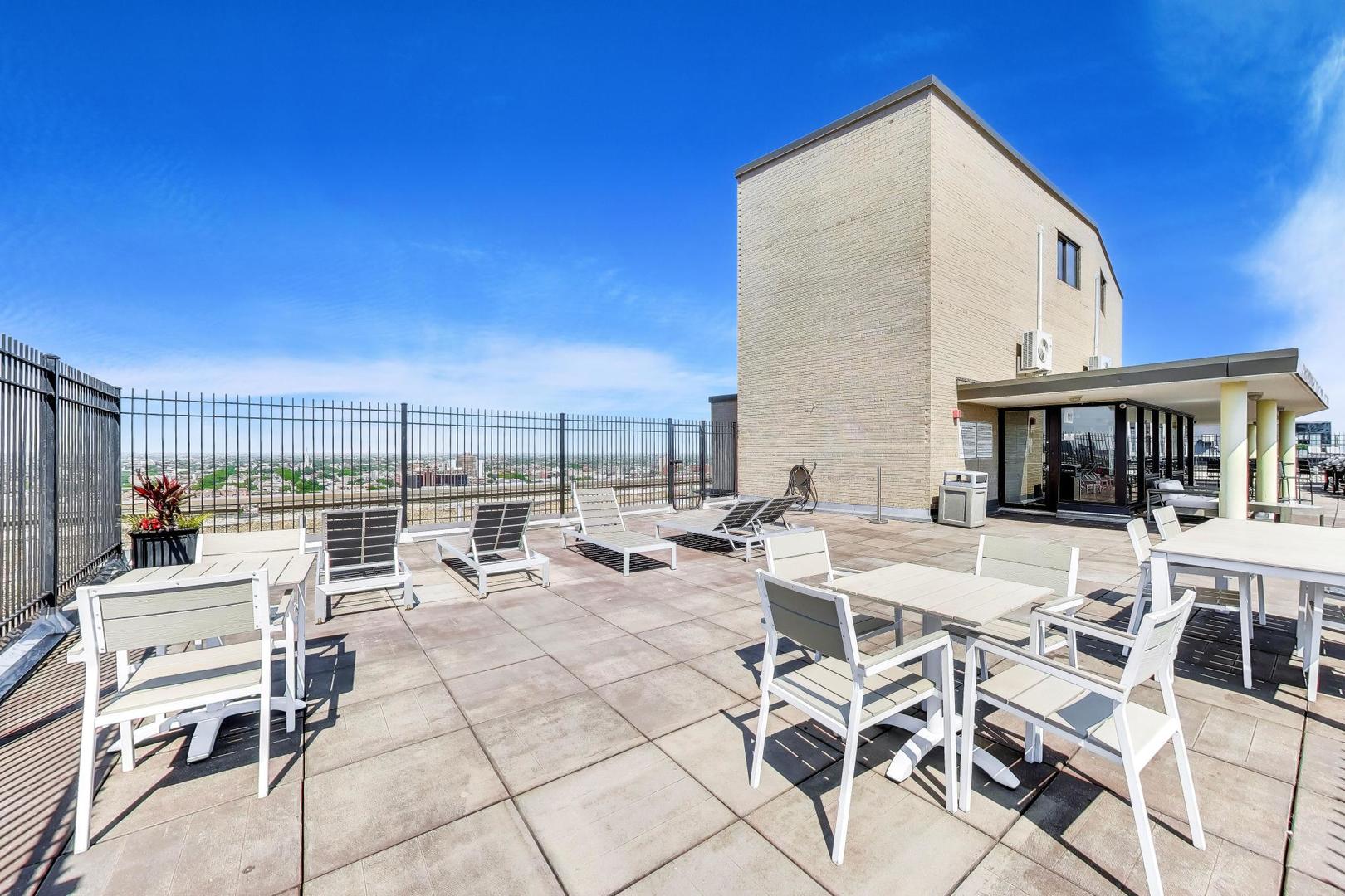 2930 North Sheridan Road, Unit 702 Chicago, IL 60657 - Photo 22 of 25 a view of a terrace with furniture and outdoor space