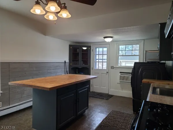 a kitchen with cabinets counter space and a sink