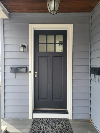 a view of a door and a window