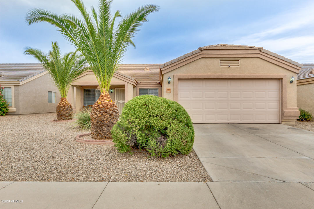 12714 West Calavar Road El Mirage, AZ 85335 - Photo 1 of 24 a front view of a house with a yard and garage