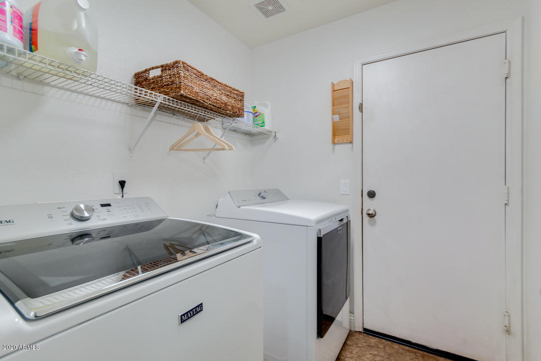 12714 West Calavar Road El Mirage, AZ 85335 - Photo 19 of 24 a utility room with dryer and washer
