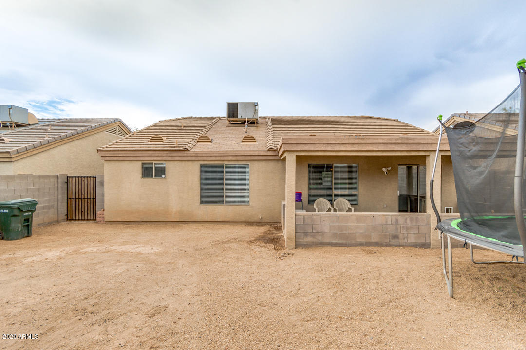 12714 West Calavar Road El Mirage, AZ 85335 - Photo 23 of 24 a front view of a house with a porch