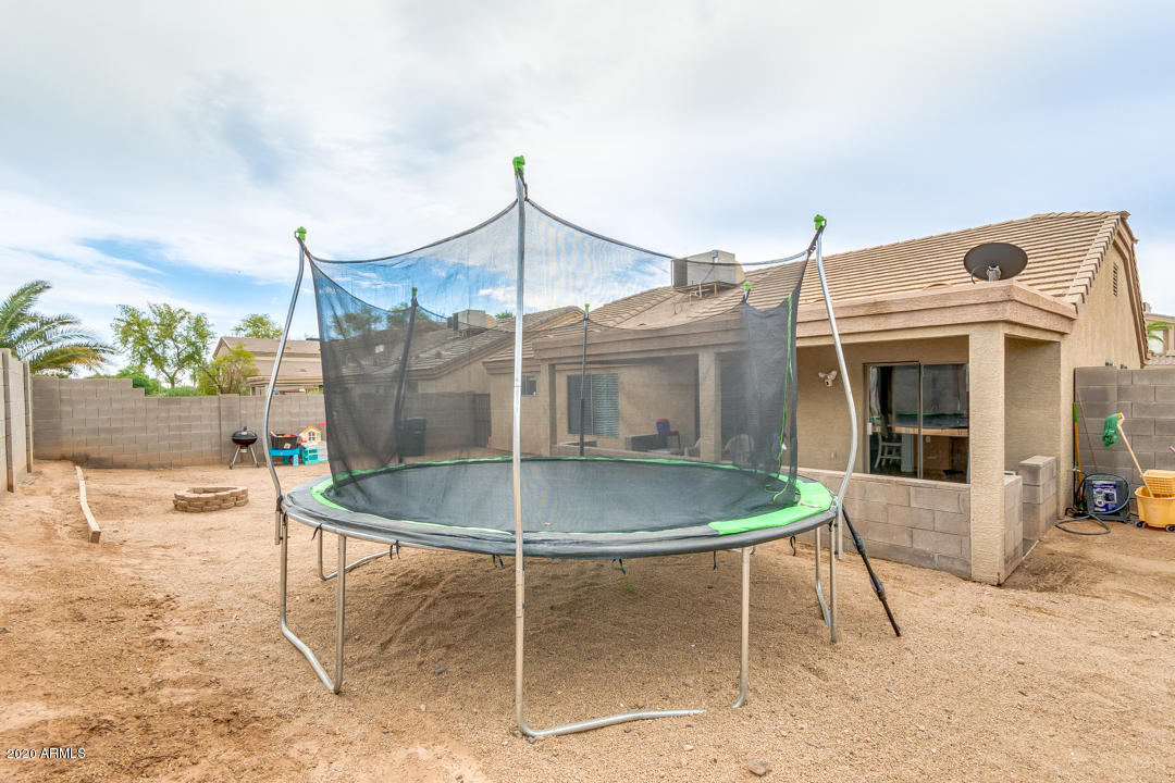 12714 West Calavar Road El Mirage, AZ 85335 - Photo 24 of 24 a dinning table and chairs in the patio