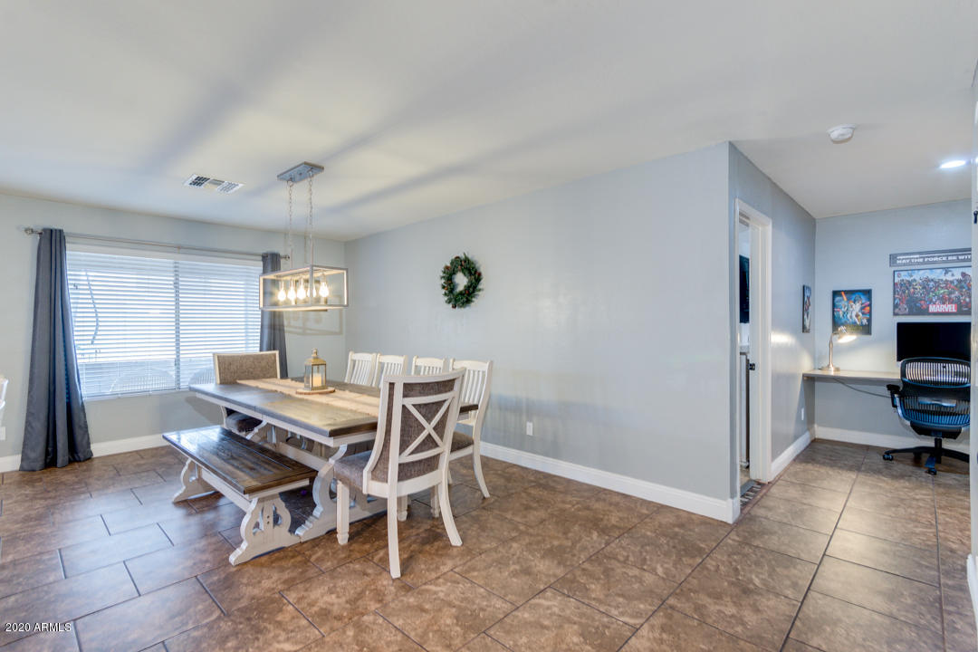 12714 West Calavar Road El Mirage, AZ 85335 - Photo 10 of 24 a view of a dining room with furniture