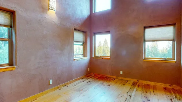 a room with window and wooden floor