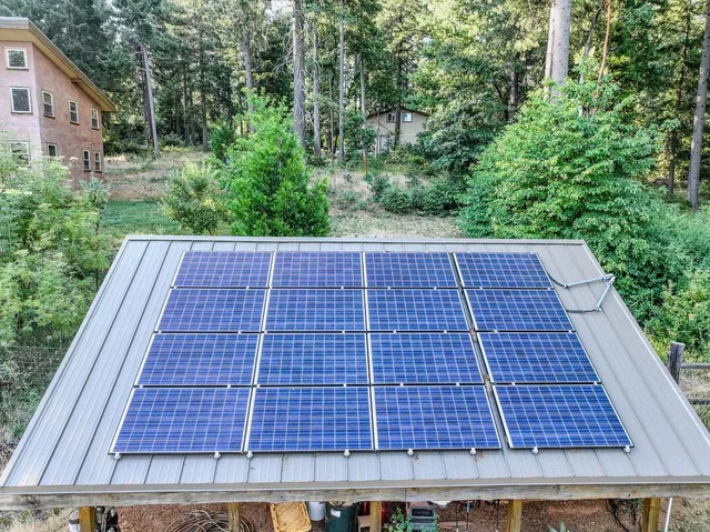 a kitchen with a stove a sink and a window
