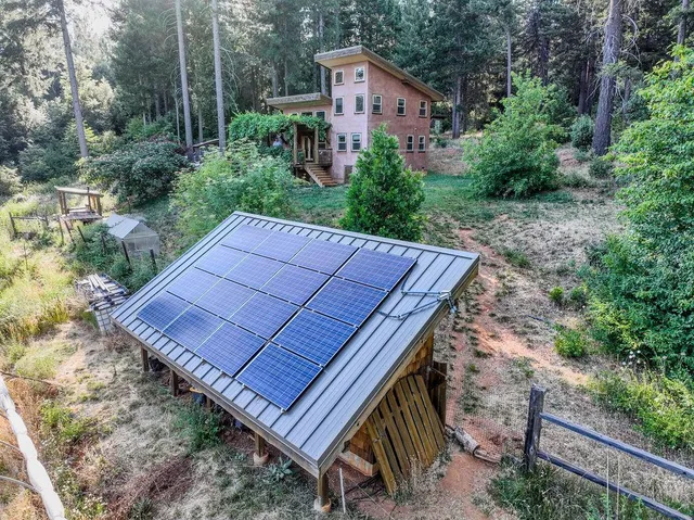 a view of an chairs and table in the patio