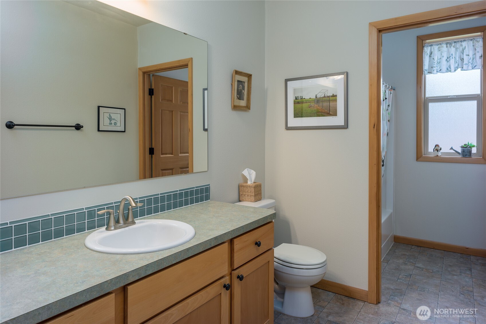 110 Clay Hill Road Lopez Island, WA 98261 - Photo 17 of 35 a bathroom with a granite countertop sink toilet and mirror