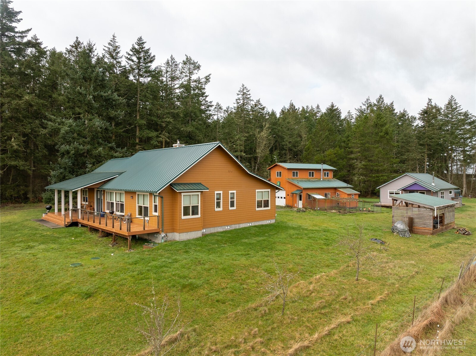110 Clay Hill Road Lopez Island, WA 98261 - Photo 30 of 35 a view of a house with a big yard and large trees