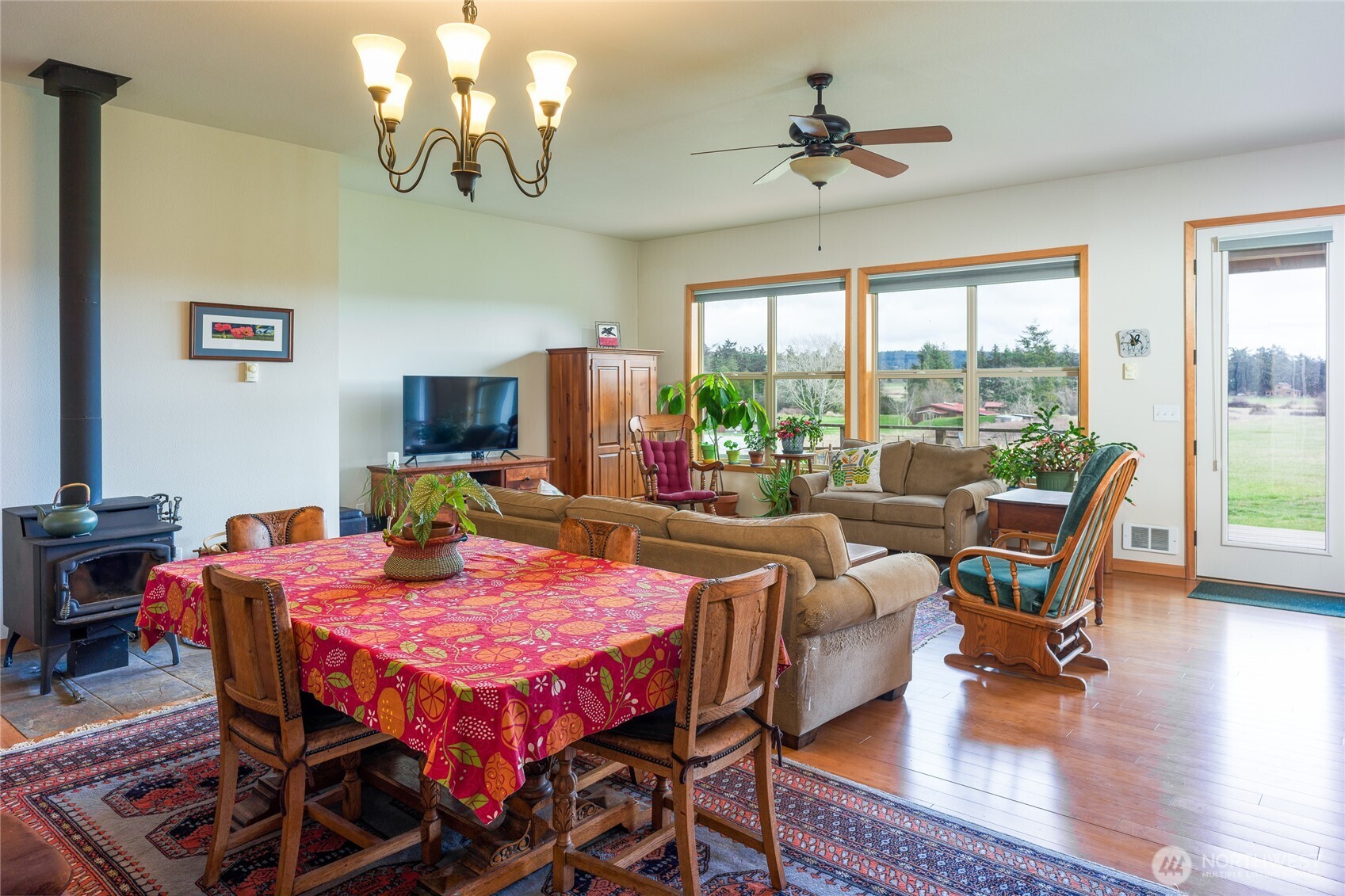 110 Clay Hill Road Lopez Island, WA 98261 - Photo 3 of 35 a view of a dining room with furniture window and wooden floor
